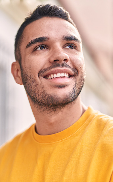 man outdorrs smiling